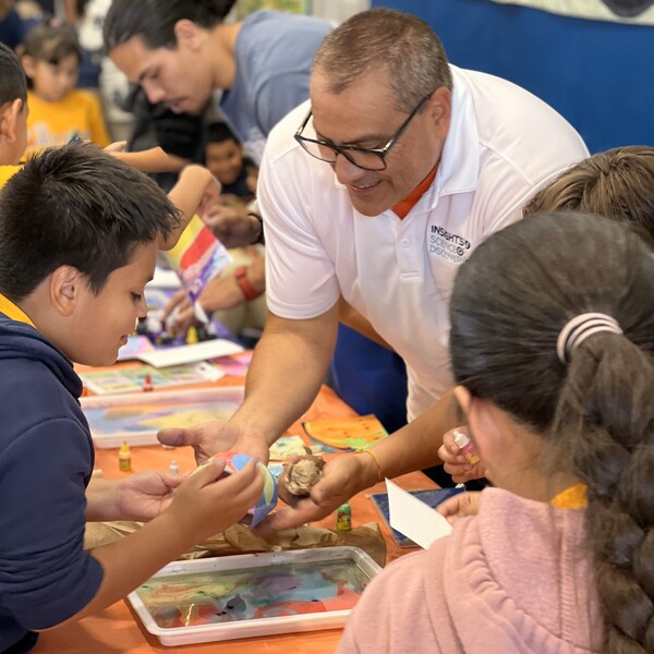 Insights' team members provides hand-on STEAM activies at a school event