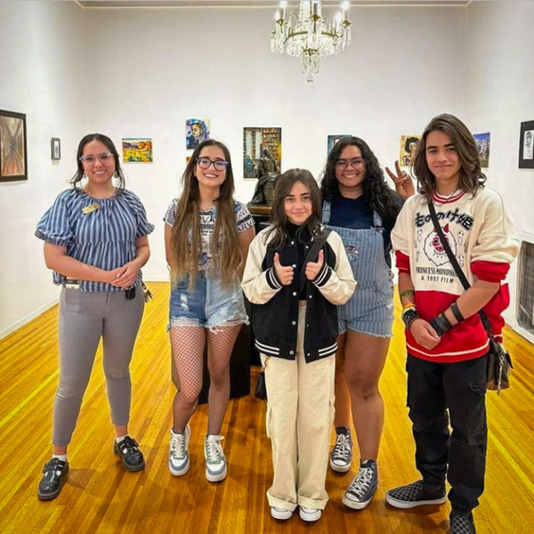 Winners of the Tom Lea Institute's contest in front of their work in the Turney Youth Gallery 