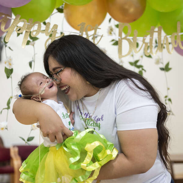 This is Dahlia a 15-month baby who is in our butterfly program. We were able to grant her family a birthday party for her. 